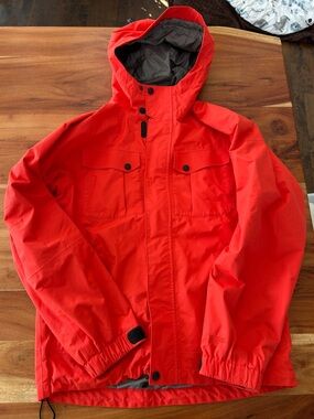 MEC Youth Watershed Rain Jacket sz 14 in bright orangish red